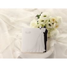 Full view of trif fold black and white wedding invitatiom; bride and groom embossed design